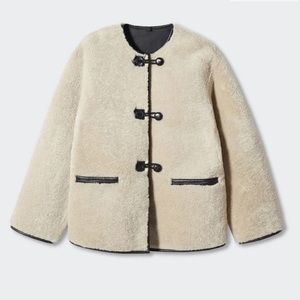 Mango Fur-effect coat with appliqués